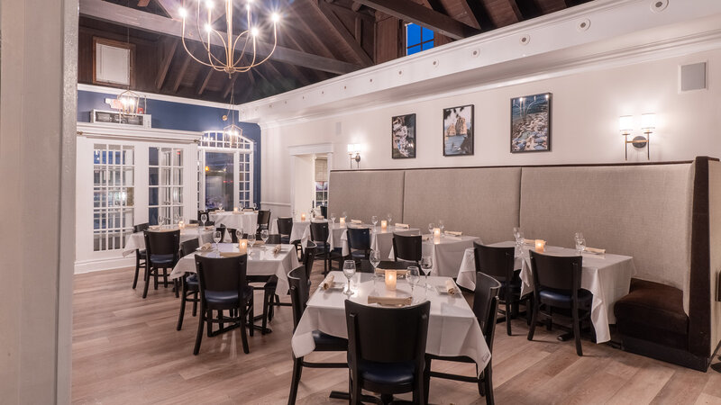 Dining room with square tables and booth seating